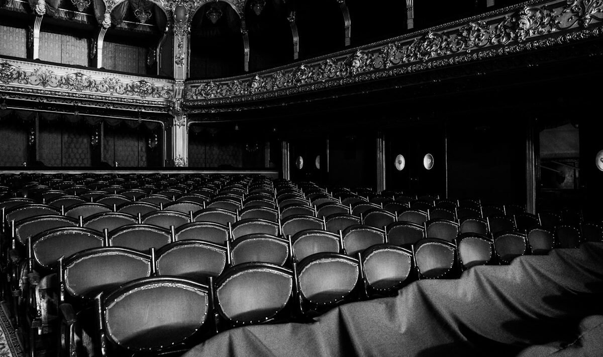 a black and white photo of an empty auditorium
