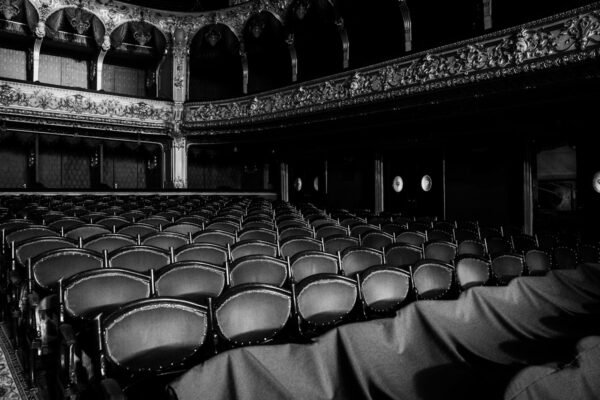 a black and white photo of an empty auditorium