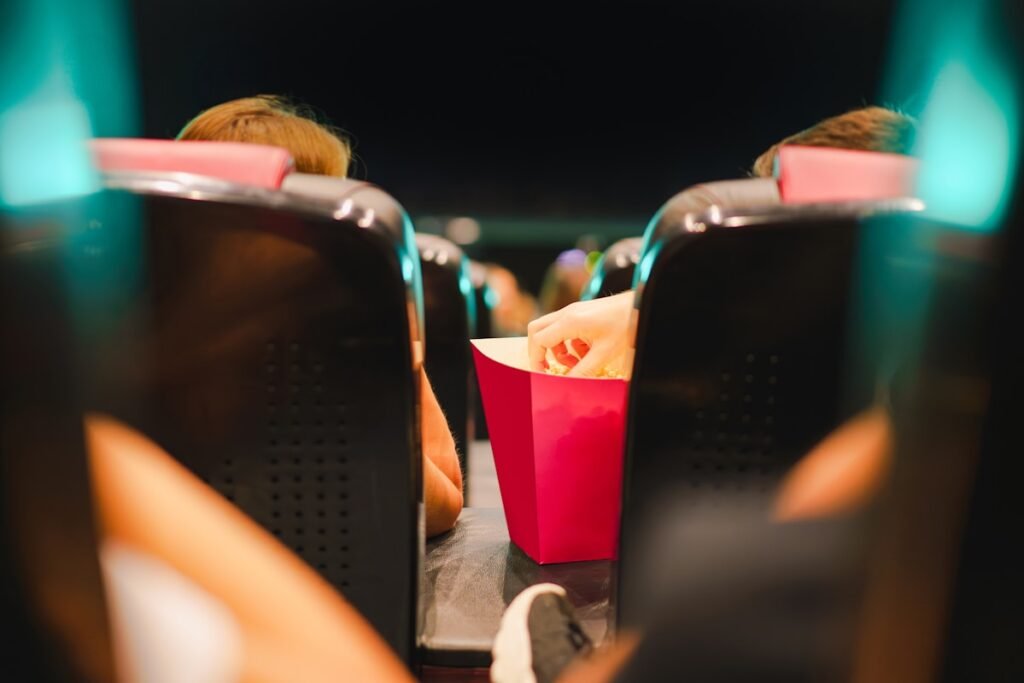 a person sitting in a chair with a red bag of food Festival e rassegne cinematografiche a Milano